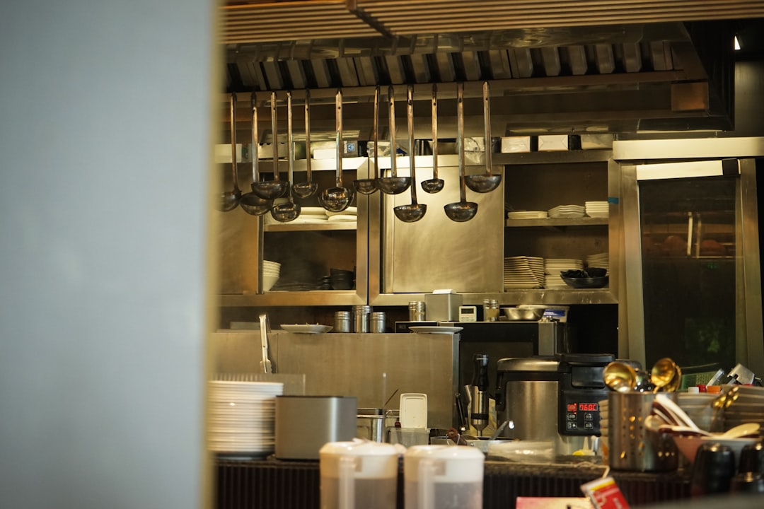 kitchen-utensils-hang-in-a-professional-kitchen-mon8l2jgbhc